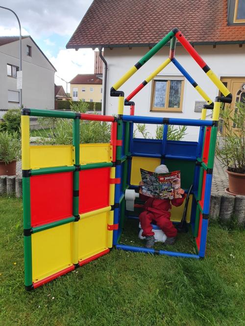 Outhouse built out of QUADRO with child inside