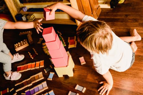 Boy building a pink tower